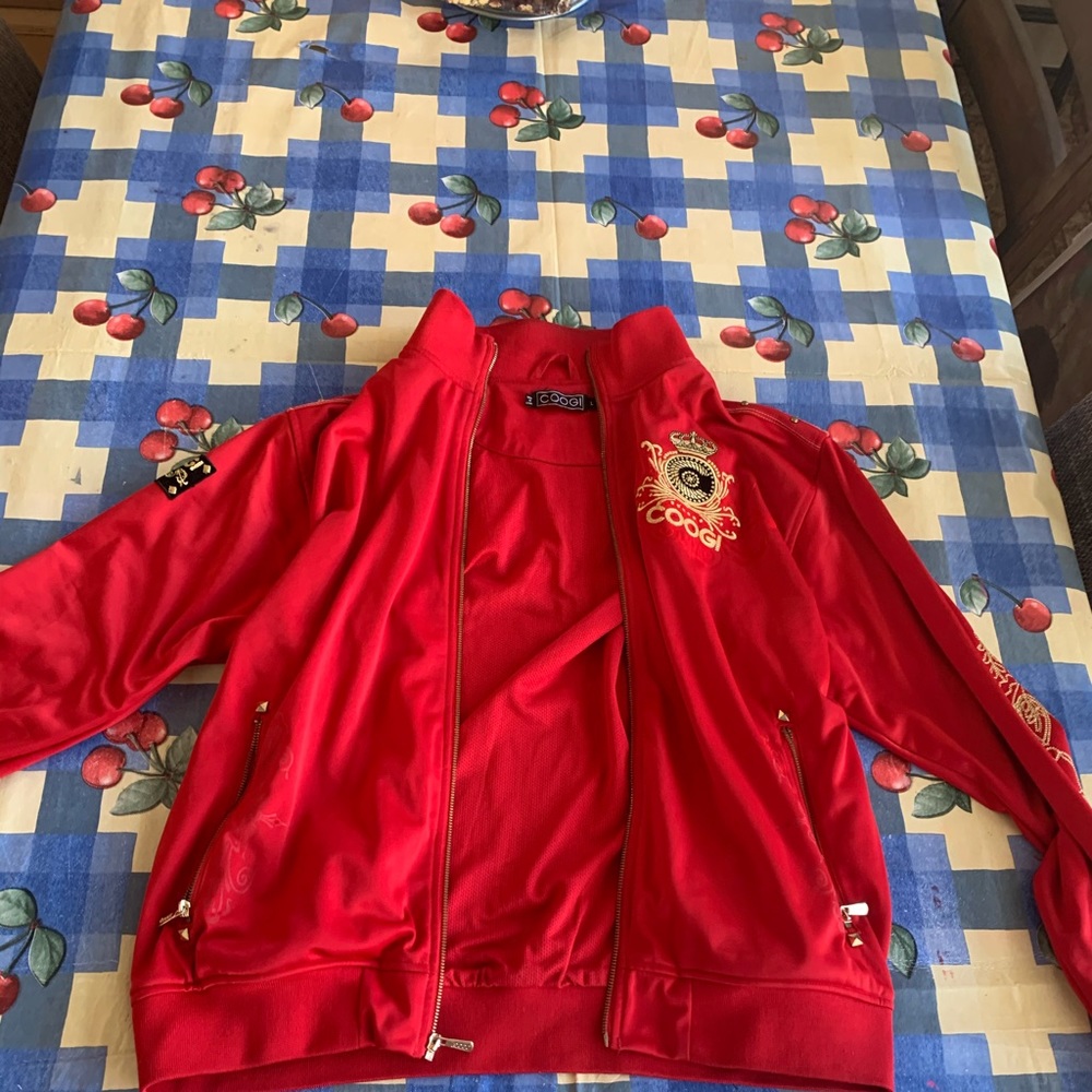 A red and gold coogi jacket